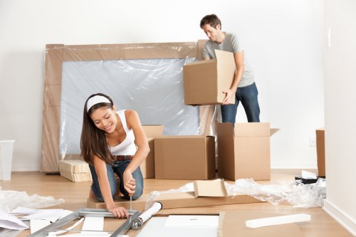 Van moving boxes safely in Brockley with insured staff
