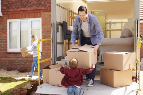 Van loader preparing furniture safely for transport