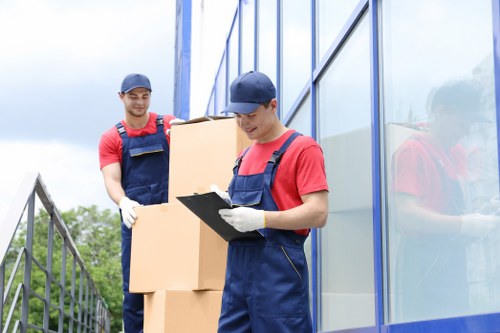 Careful packing of fragile household items by Brockley moving professionals
