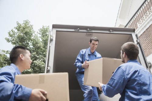 Worker assessing a loaded van before transit
