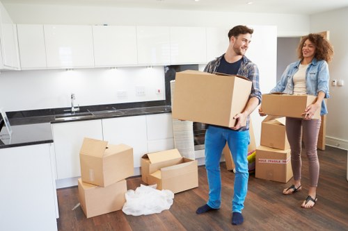 Urgent home move with packed boxes and removal van