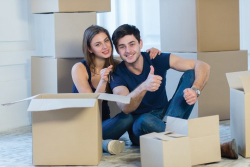 Team using safe lifting techniques during a move