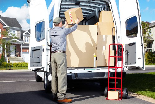 Removals team handling furniture in a Brockley apartment building