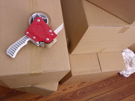 Packed boxes and furniture ready for transport in Brockley