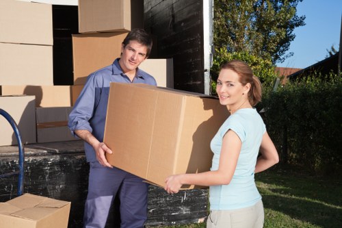Local Brockley movers carefully packing household items for relocation