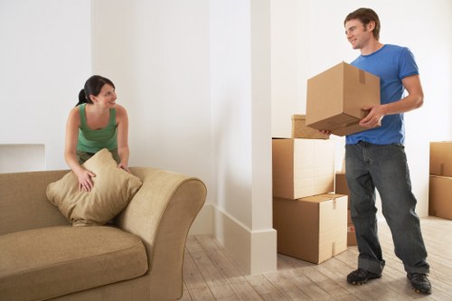 Packed moving boxes and furniture ready for removals in Brockley